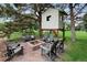 Charming backyard with a fire pit and custom-built treehouse for outdoor fun at 9669 E Prentice Cir, Greenwood Village, CO 80111