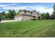 Expansive backyard featuring lush lawn and stylish home exterior at 9669 E Prentice Cir, Greenwood Village, CO 80111