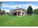 Expansive backyard with lush green lawn, perfect for outdoor enjoyment at 9669 E Prentice Cir, Greenwood Village, CO 80111