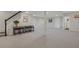 Spacious finished basement with room for entertainment and relaxation by the stairs at 9669 E Prentice Cir, Greenwood Village, CO 80111