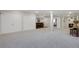 Large, open finished basement with a bar, gym area, and ample space for recreation at 9669 E Prentice Cir, Greenwood Village, CO 80111