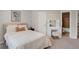 Bedroom with a vanity, plush accents, and ensuite bathroom at 9669 E Prentice Cir, Greenwood Village, CO 80111