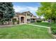 Charming two-story home with a well-manicured lawn, mature trees, and inviting curb appeal at 9669 E Prentice Cir, Greenwood Village, CO 80111