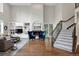 Bright living room with hardwood floors, a cozy fireplace, and large windows for natural light at 9669 E Prentice Cir, Greenwood Village, CO 80111
