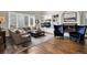 Inviting living room features hardwood floors, built-in shelving, a cozy fireplace, and comfortable seating at 9669 E Prentice Cir, Greenwood Village, CO 80111