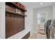 Convenient mud room with bench, storage, and easy access to laundry at 9669 E Prentice Cir, Greenwood Village, CO 80111