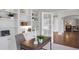 Stylish home office featuring built-in bookshelves, a modern desk, and ample natural light at 9669 E Prentice Cir, Greenwood Village, CO 80111