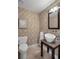Powder room featuring decorative wall paper, granite countertop with modern sink, and tile flooring at 9669 E Prentice Cir, Greenwood Village, CO 80111