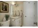 Bathroom with marble counters, soft lighting and commode at 19810 County Road 1, Berthoud, CO 80513