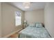Bedroom with light hardwood floors, natural light, and a side table with lamp at 19810 County Road 1, Berthoud, CO 80513