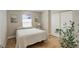 Bedroom with light hardwood floors, natural light, and a double-door closet at 19810 County Road 1, Berthoud, CO 80513