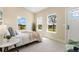 Bright bedroom with multiple windows offering scenic views and neutral decor at 19810 County Road 1, Berthoud, CO 80513