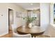 Dining area showcasing a round wood table with seating and decorative accents at 19810 County Road 1, Berthoud, CO 80513