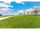 Expansive lawn featuring home, shed, and gravel driveway at 19810 County Road 1, Berthoud, CO 80513
