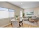 Bright living room featuring a sectional sofa, wood floors, and a view from the window at 19810 County Road 1, Berthoud, CO 80513