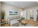 Comfortable living room featuring a sectional sofa, area rug, and hardwood floors at 19810 County Road 1, Berthoud, CO 80513
