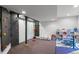 Finished basement with a climbing wall and playroom at 24355 E Briarwood Ave, Aurora, CO 80016
