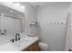 Clean bathroom featuring a light wood vanity, updated fixtures, and tub with shower at 24355 E Briarwood Ave, Aurora, CO 80016
