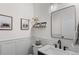 Elegant powder room with modern fixtures, decorative mirror, and stylish decor at 24355 E Briarwood Ave, Aurora, CO 80016