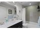 Updated bathroom with a shower and bathtub at 24355 E Briarwood Ave, Aurora, CO 80016
