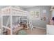 Cozy bedroom with a loft bed, shelving, and an additional seating area below at 24355 E Briarwood Ave, Aurora, CO 80016