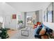 Inviting living room filled with natural light, wood floors, stylish decor, and comfortable seating at 24355 E Briarwood Ave, Aurora, CO 80016