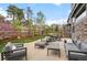 Patio with outdoor seating and lush green lawn at 24355 E Briarwood Ave, Aurora, CO 80016