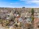 Aerial view of a neighborhood showcasing the subject property nestled among mature trees and charming homes at 3361 W 29Th Ave, Denver, CO 80211