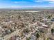 Expansive aerial view of residential neighborhood with mountain backdrop under a clear blue sky at 3361 W 29Th Ave, Denver, CO 80211