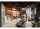 Unfinished basement with brick walls and exposed ceiling, ready for your personalization to create a unique space at 3361 W 29Th Ave, Denver, CO 80211