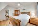 Cozy bedroom featuring wood floors and comfortable lighting at 3361 W 29Th Ave, Denver, CO 80211