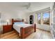 Bright bedroom with wood floors, ceiling fan, and large windows overlooking the neighborhood at 3361 W 29Th Ave, Denver, CO 80211