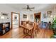 Charming dining area boasts hardwood floors and seamless access to the kitchen and living spaces at 3361 W 29Th Ave, Denver, CO 80211