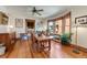 Open dining room boasts hardwood floors, a ceiling fan, and a bay window with neighborhood views at 3361 W 29Th Ave, Denver, CO 80211