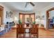 Light-filled dining room showcases hardwood floors and a large bay window offering neighborhood views at 3361 W 29Th Ave, Denver, CO 80211