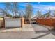 Large driveway leading to a detached garage, with additional parking and a gated entrance at 3361 W 29Th Ave, Denver, CO 80211