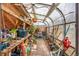 Greenhouse filled with plants, gardening tools, and natural light, perfect for the gardening enthusiast at 3361 W 29Th Ave, Denver, CO 80211