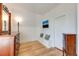 Hallway with hardwood floors, built-in bench, and classic trim at 3361 W 29Th Ave, Denver, CO 80211