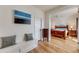 Hallway featuring a built-in bench and view into bedroom at 3361 W 29Th Ave, Denver, CO 80211