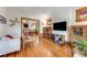 Inviting living room with hardwood floors, classic woodwork, seamlessly connects to the dining room, bright and airy at 3361 W 29Th Ave, Denver, CO 80211