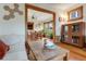 Spacious living room with hardwood floors, classic woodwork, seamlessly connects to the dining room. Well-lit and airy at 3361 W 29Th Ave, Denver, CO 80211