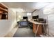 Basement office space with carpet and exposed brick walls at 3361 W 29Th Ave, Denver, CO 80211