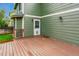 Lovely back porch with a charming green house, wooden deck and a welcoming doormat at 156 S Lindsey St, Castle Rock, CO 80104
