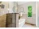 Bright bathroom features a bathtub and a shower with glass doors at 156 S Lindsey St, Castle Rock, CO 80104