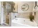 Elegant bathroom boasts a tub and a glass-enclosed shower at 156 S Lindsey St, Castle Rock, CO 80104