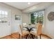 Cozy breakfast nook with a glass-top table, comfortable seating, and a view of the backyard at 156 S Lindsey St, Castle Rock, CO 80104