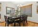 Dining room with hardwood floors, modern chandelier, and large window providing ample natural light at 156 S Lindsey St, Castle Rock, CO 80104