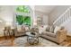 Bright living room with high ceilings, large windows, neutral decor, comfortable seating, and hardwood floors at 156 S Lindsey St, Castle Rock, CO 80104