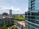 Expansive view of the cityscape with modern buildings, green spaces, and distant mountain views at 1700 Bassett St # 1119, Denver, CO 80202