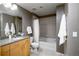 Modern bathroom with granite countertops, tub and shower at 1700 Bassett St # 1119, Denver, CO 80202